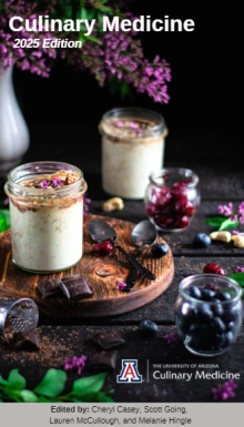 porridge on a black background with mint, blueberries, and shaved dark choclate